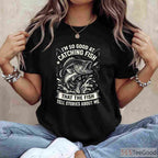 Expert Angler Catching Fish Design - Bold Graphic Tee for Skilled Fishermen